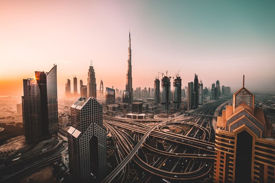 Dubai skyline glowing at dusk