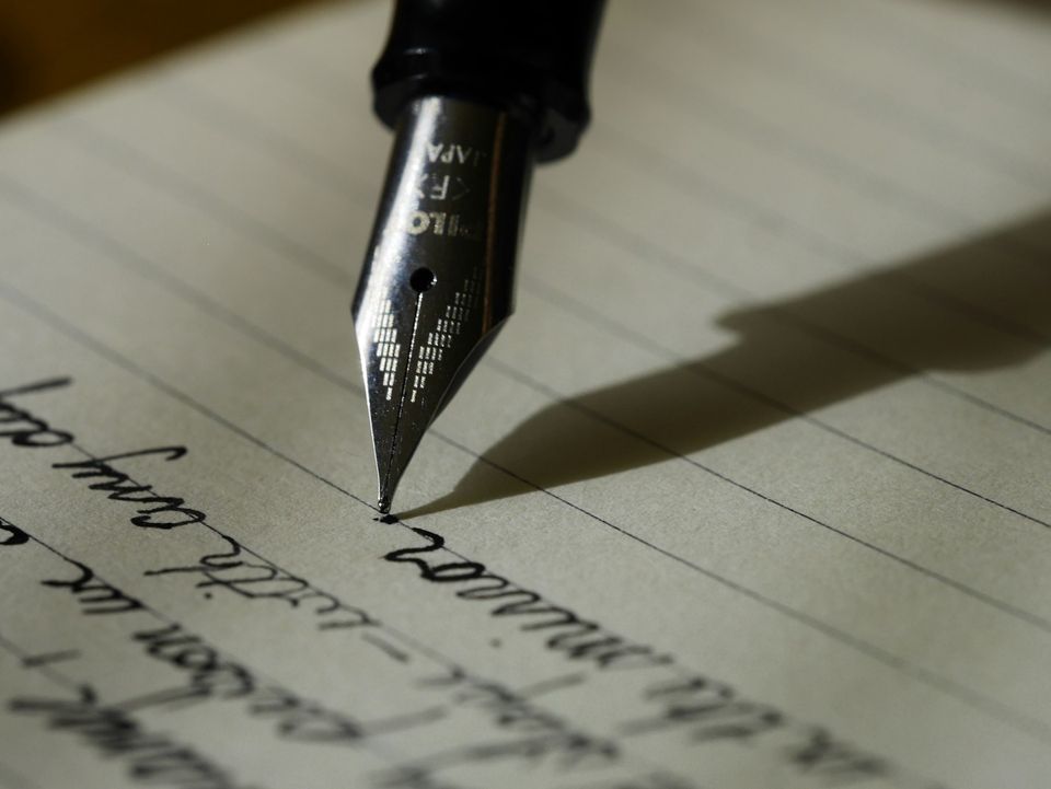 Fountain pen writing on warm lined paper